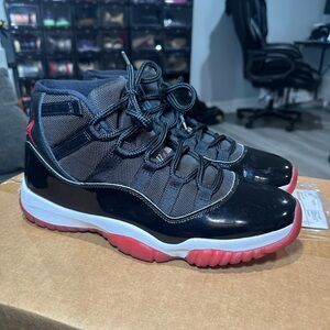 Jordan 11 (Bred) Black and Red High-Top Sneakers